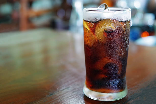 istock Iced cola with water drops condensed on glass surface 599717404