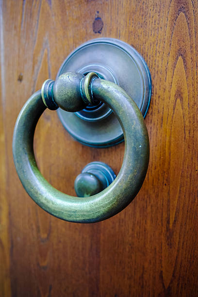 istock Old ancient door knocker on wooden door 599717424