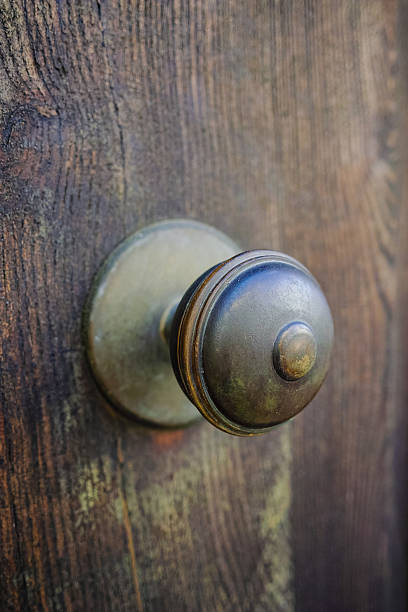 istock Old ancient door knocker on wooden door 599717818