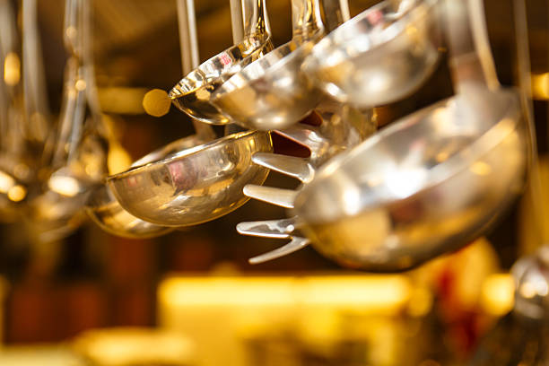 Kitchenware hanging in the kitchen of the restaurant.