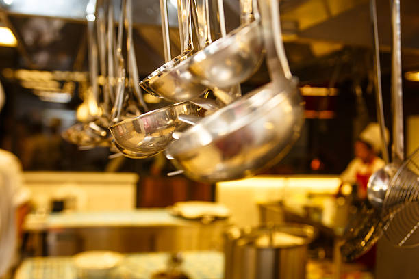 Kitchenware hanging in the kitchen of the restaurant.