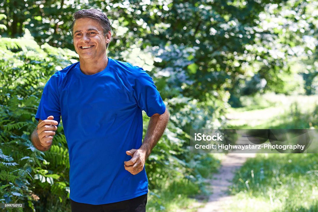 Mature Man Running Outdoors In Countryside Mature Men Stock Photo