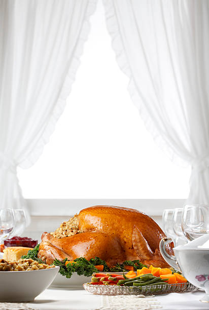 istock Thanksgiving Turkey As Centerpiece In A Thanksgiving  Feast 599753916