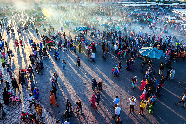 Evening Djemaa El Fna Square with Koutoubia Mosque, Marrakech, Morocco Famous Djemaa El Fna Square in early evening light, Marrakech, Morocco with the Koutoubia Mosque, Northern Africa.Nikon D3x djemma el fna square stock pictures, royalty-free photos & images