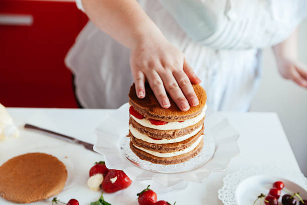 istock Woman Making The Naked Cake 599756500
