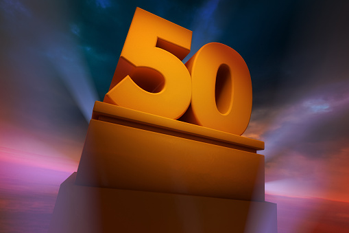 Golden number Fifty as a Three Dimensional Rendering with spotlights and dramatic sky