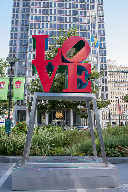 PHILADELPHIA,PA/USA - 5-19-2022: I Heart Philly sign with City Hall in the background at the corner of Market St and Broad St downtown