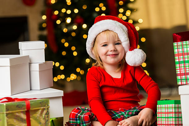 istock Mischievous little girl on Christmas morning 599760876