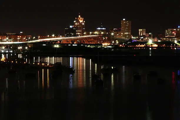 milwaukee skyline at night, full of reflections, and sparkly lights 