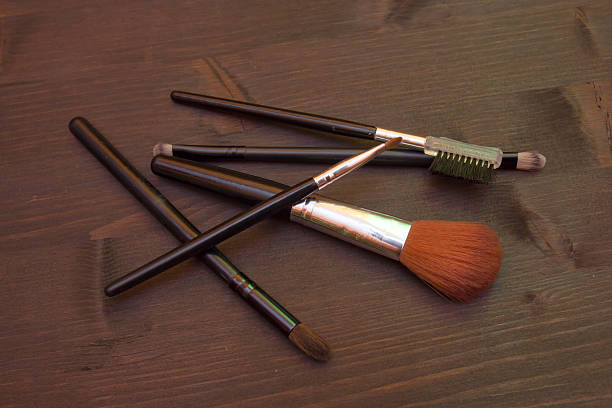 istock Some makeup brushes on wood seen from above 599761920