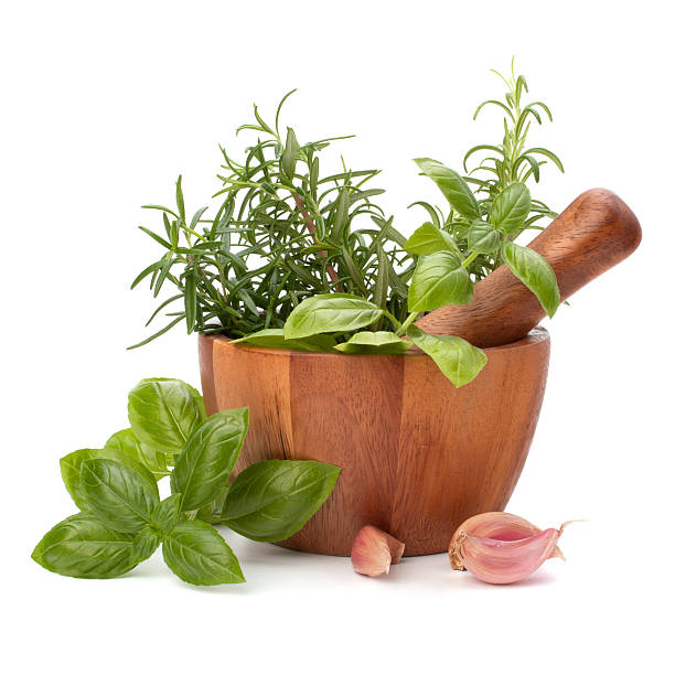 istock fresh flavoring herbs and spices in wooden mortar 599762472