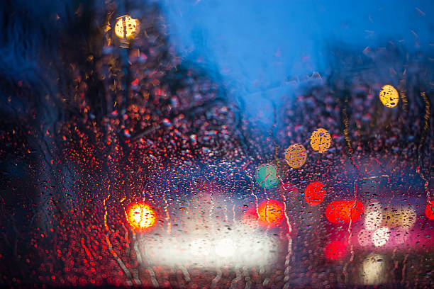istock cars windshield On a rainy night 599762568