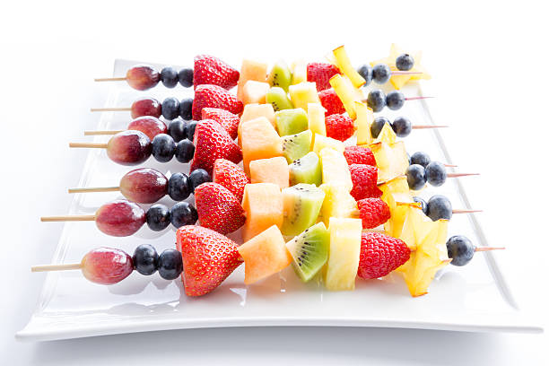 istock Serving of colorful fresh fruit kebabs 599763718