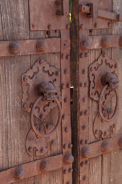 istock Rustic antique wood door background 599764550