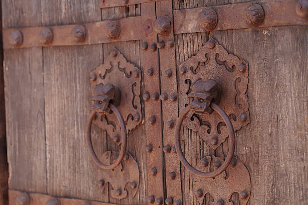 istock Rustic antique wood door background 599764592
