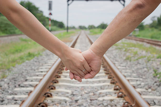 istock feeling lovely couple. Hands together 599764676