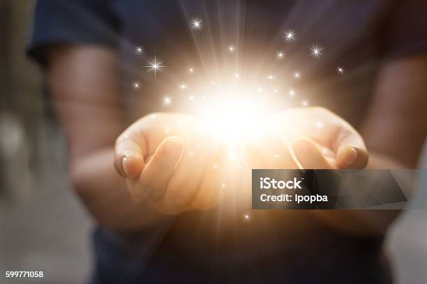 Stardust And Magic In Woman Hands On Dark Background Stock Photo - Download Image Now