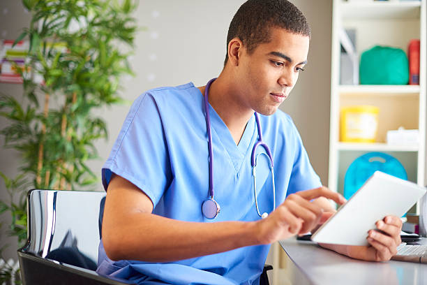 istock gp updating medical notes 599778348