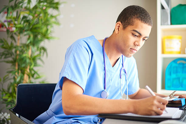 medical student updating medical notes