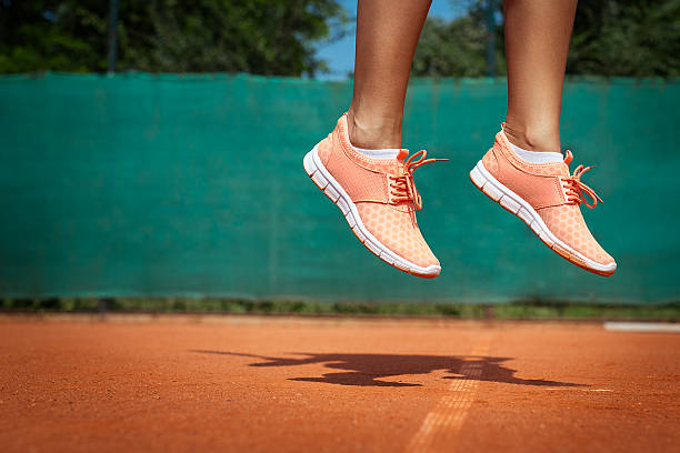 istock Female tennis player legs 599780188