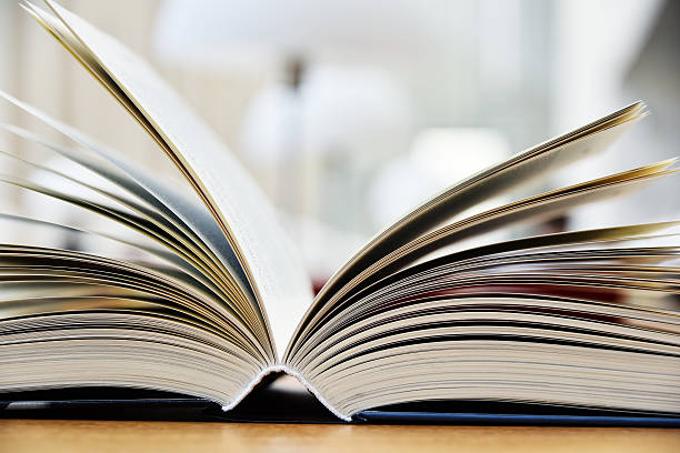 istock Hardcover book lying on the table in a library 599780764