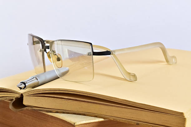 istock Books glasses and pen 599781884