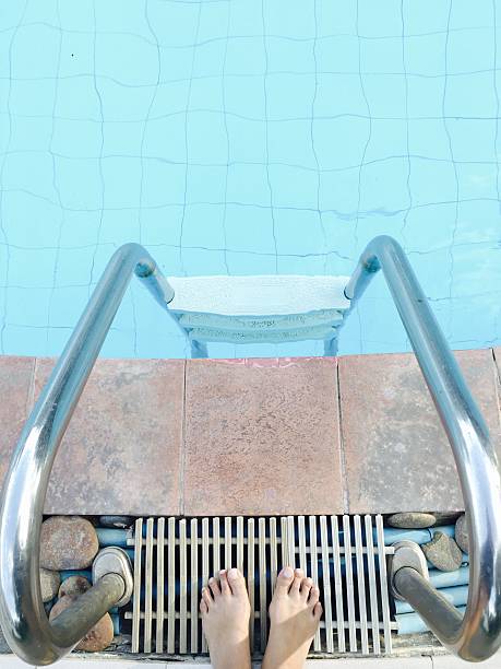 istock Someone standing to go swim with ladder, chrome tone 599782452