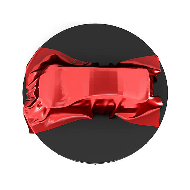 istock Presentation of the car covered with red satin cloth. 599782608