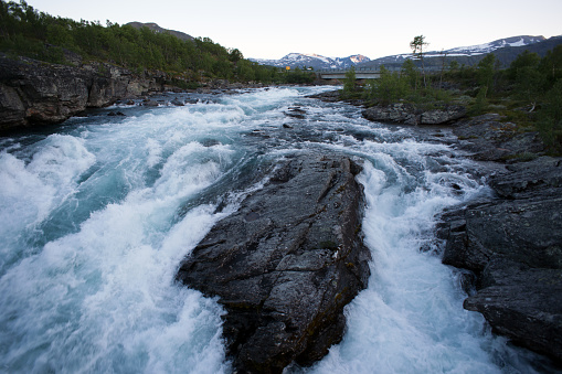 Raging river in mountain plateau Valdresflye, Jotunheimen, Norway