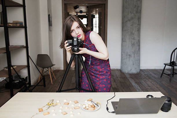 istock Female photographer working with sweets at studio 599788456