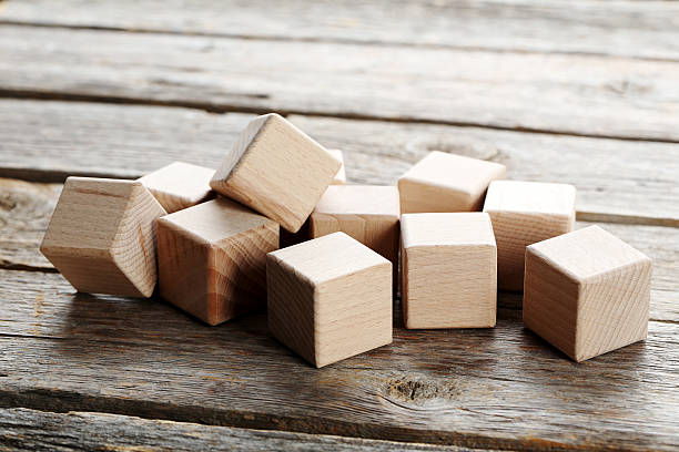 istock Wooden toy cubes on a grey wooden table 599788690