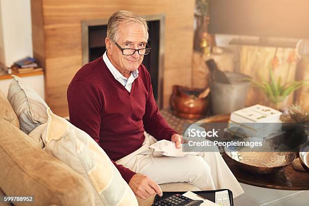 Saving Money And Stretching Dollars Is Important Stock Photo - Download Image Now - 70-79 Years, Adult, Adults Only