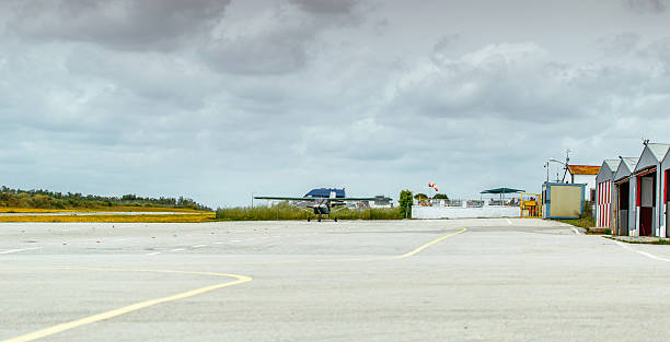 airstrip in the aerodrome la juliana, seville, spain - parachuting open parachute opening imagens e fotografias de stock