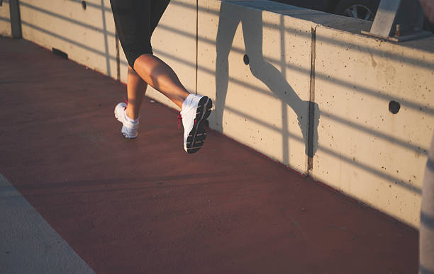 istock Close up of friends jogging 599789468