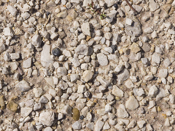 istock Abstract pebble stones in concrete background texture macro, selective focus 599789754