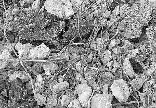 pile of smashed asphalt rubble and rusty rebar steel, Black and white