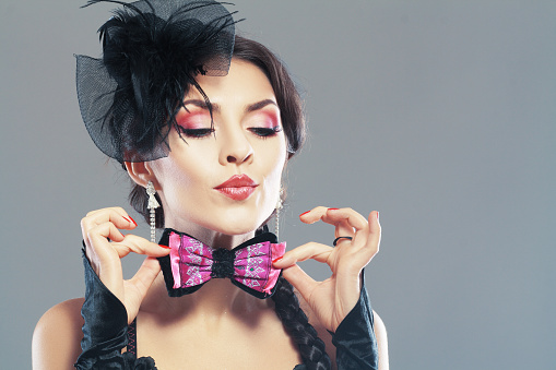 Woman Portrait. Vintage Style Girl Wearing Old fashioned Hat and Gloves. Fashion tones