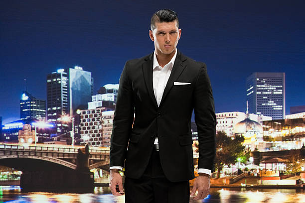 istock Businessman standing outdoors at night in city 599793070