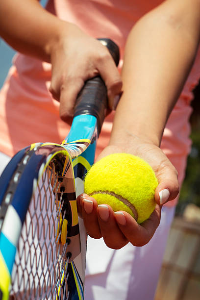 istock Tennis player holding racket and ball in hands 599866486
