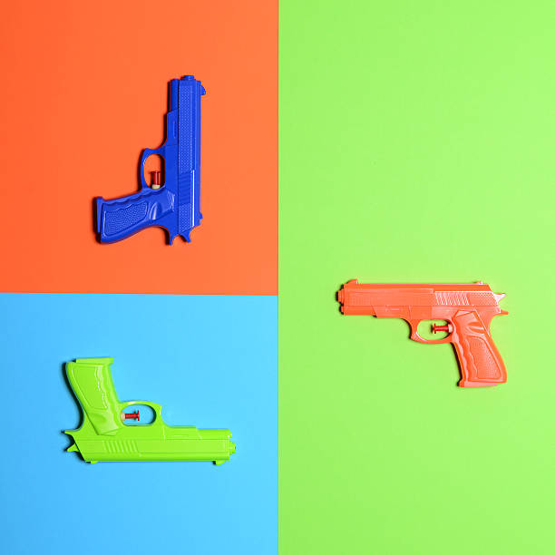 Toy pistols on colorful background  - Minimal design top view