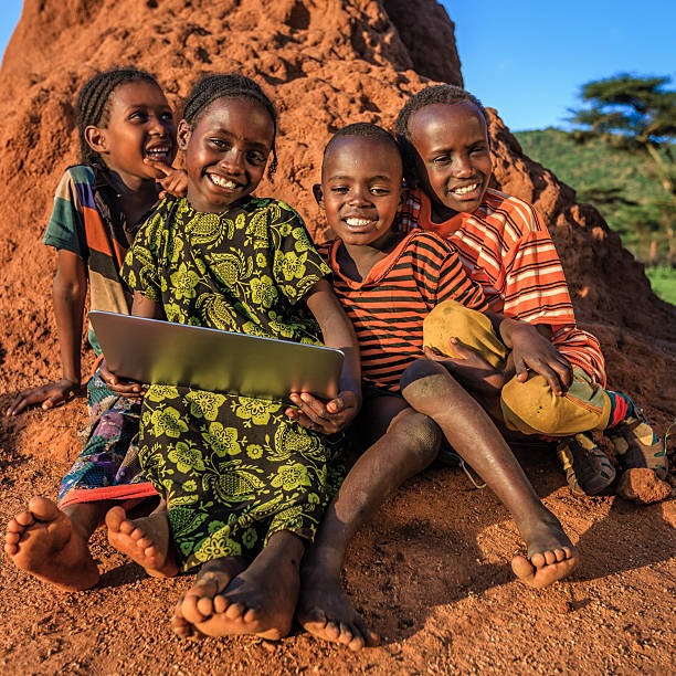istock Little African children using laptop, East Africa 599867516