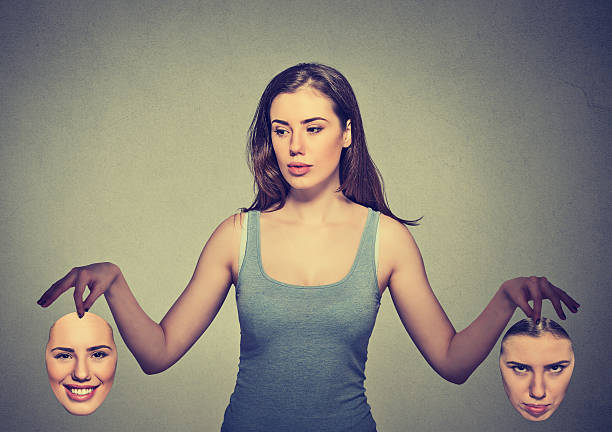 istock beautiful girl holds two masks 599867832