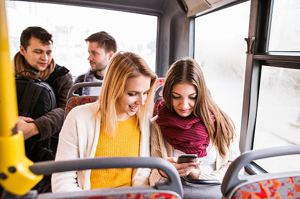 istock Group of young people traveling by bus, having fun 599867836