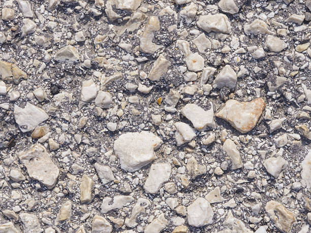 istock Abstract pebble stones in concrete background texture macro, selective focus 599869098
