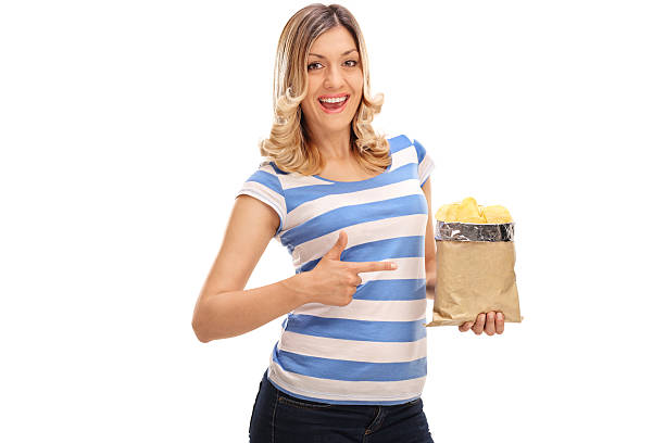 istock Woman holding a bag of potato chips 599871002
