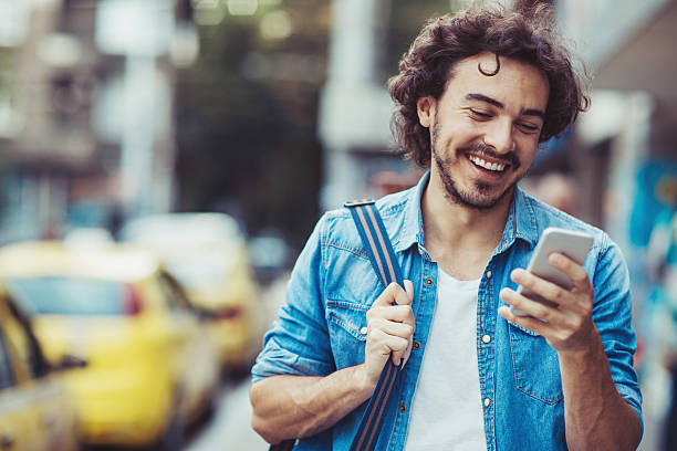 istock Man chacking messages on the street 599873160