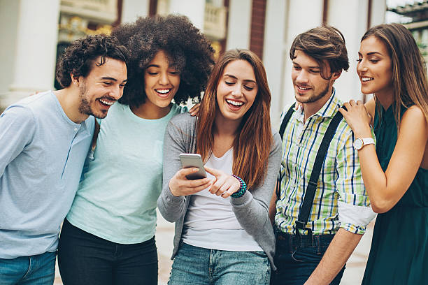 istock Young friends sharing photos 599873624