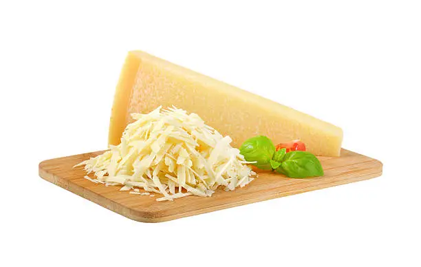 grated parmesan cheese on wooden cutting board