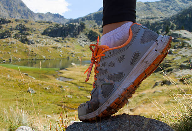 istock Women foot walking on the mountains 599876034