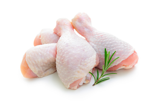 Raw chicken legs on white background isolated